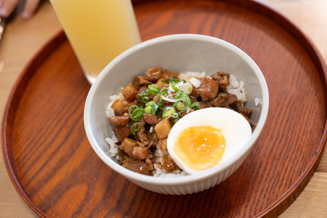 A bowl of Taiwanese braised pork rice with a soft-boiled egg