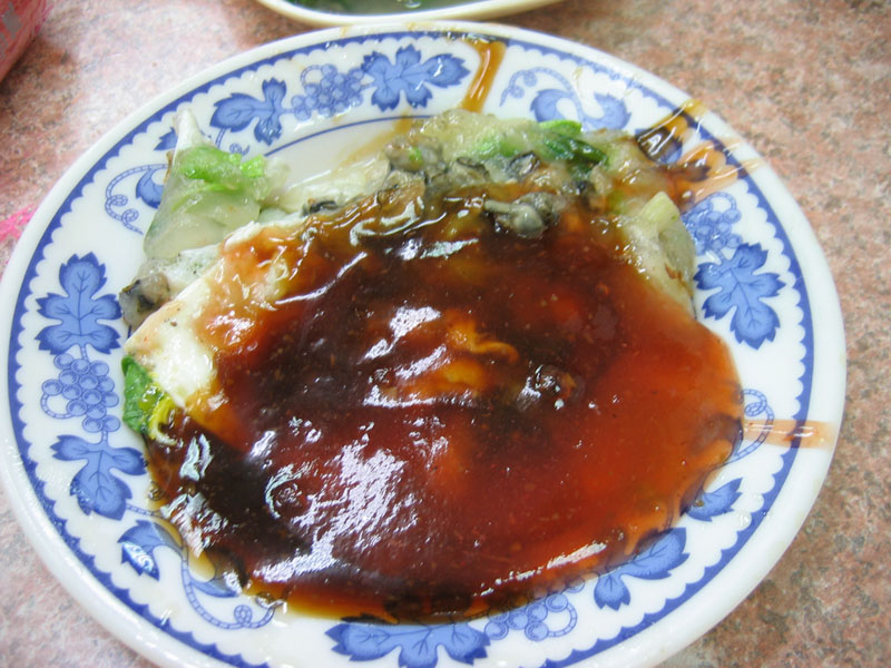 A Taiwanese oyster omelette (蚵仔煎) with egg, sweet-potato starch batter, and sweet-savory sauce