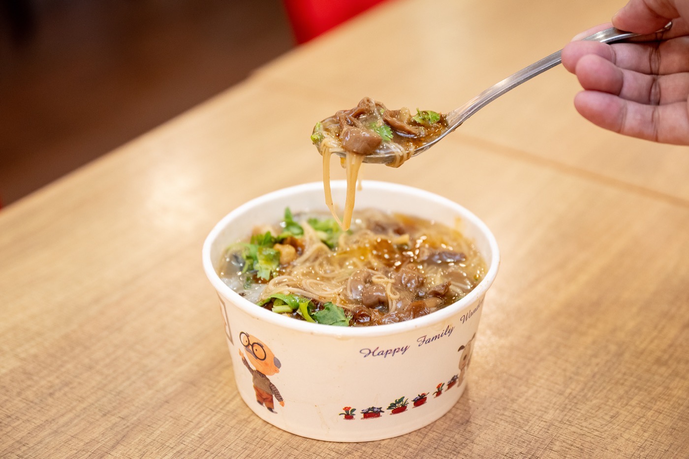 A bowl of Taiwanese oyster vermicelli (蚵仔麵線) in thickened broth, topped with cilantro